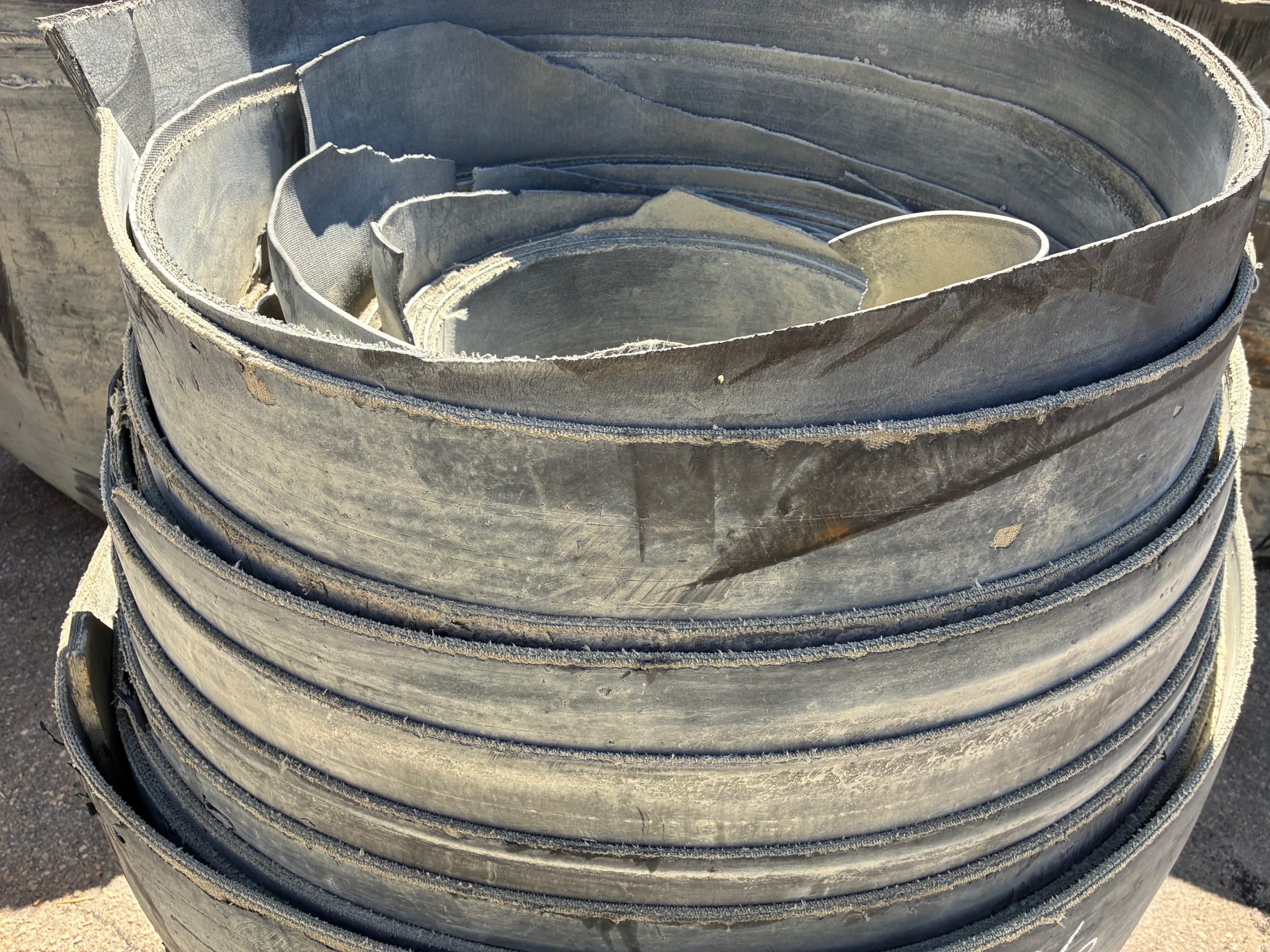 A roll of used rubber conveyor