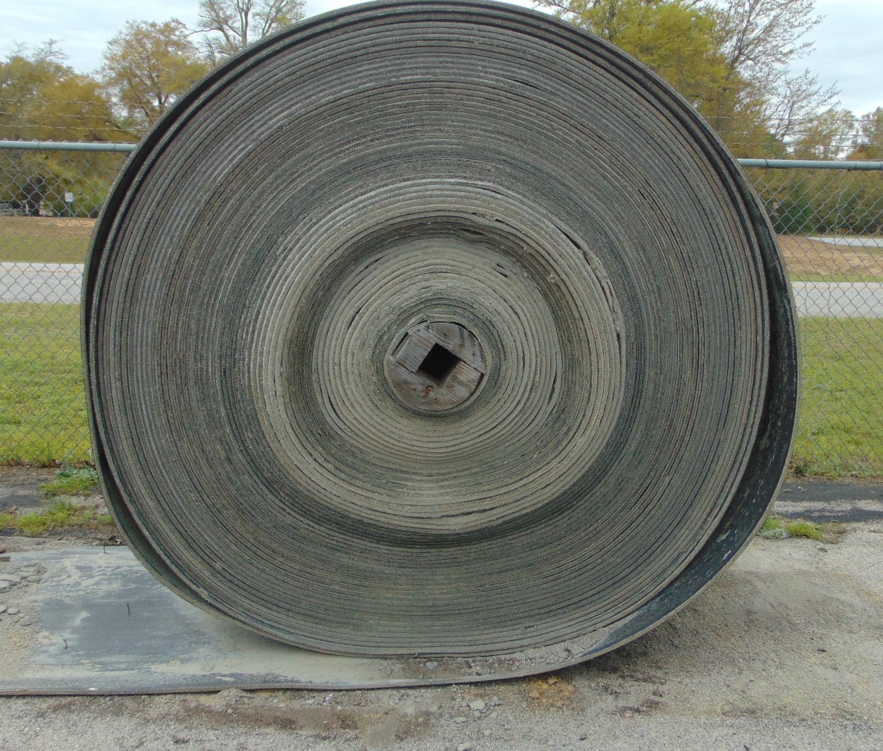 A roll of used rubber conveyor