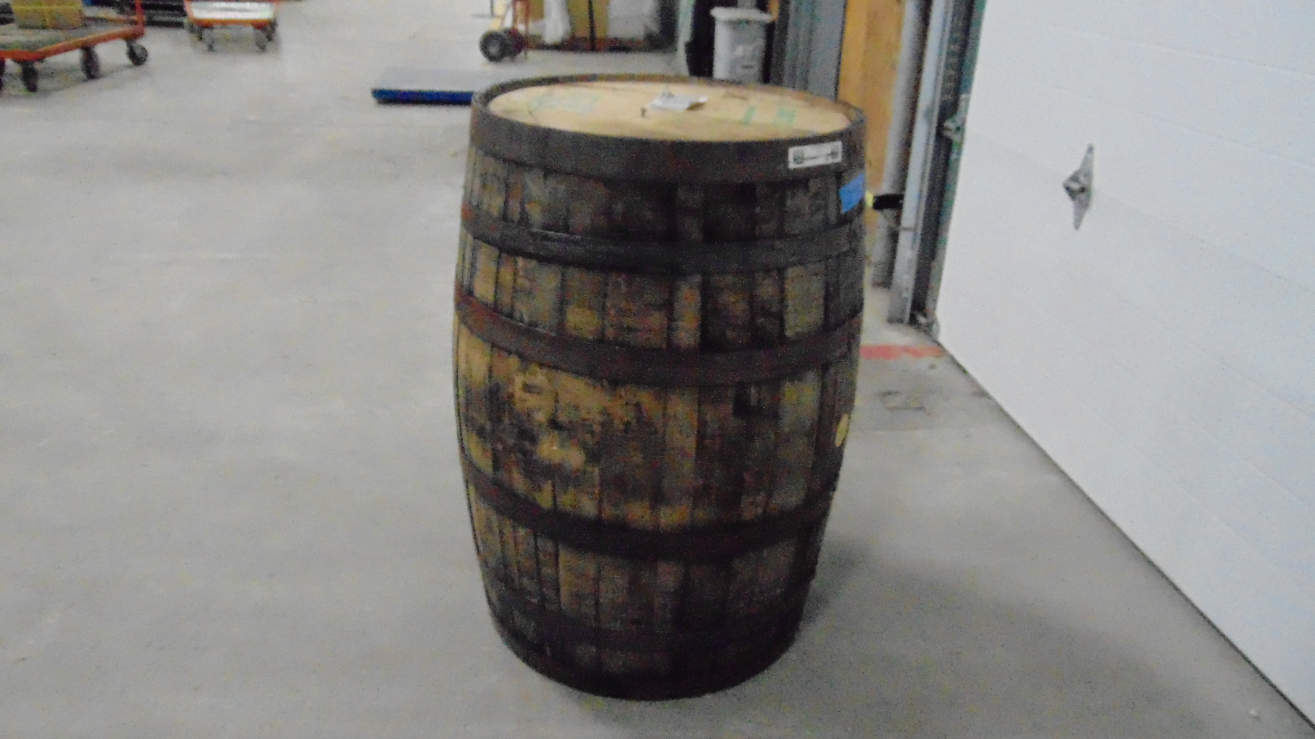 A used wooden whiskey barrel